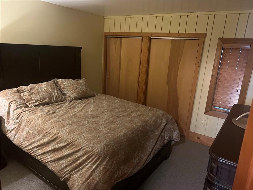 274 Alpine Heights Road Champion, PA 15622 - Photo 13 of 34 a bed sitting in a bedroom next to a window