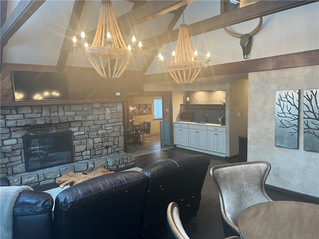 274 Alpine Heights Road Champion, PA 15622 - Photo 4 of 34 a living room with furniture a chandelier and a fireplace
