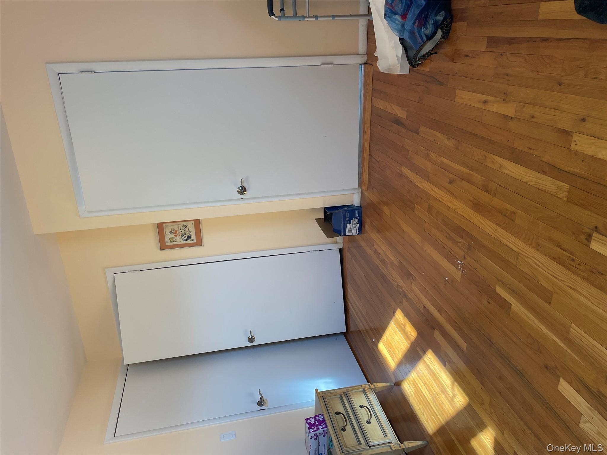 154-58 20th Road Queens, NY 11357 - Photo 12 of 27 a view of empty room with wooden floor