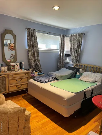 a room with pool table and windows