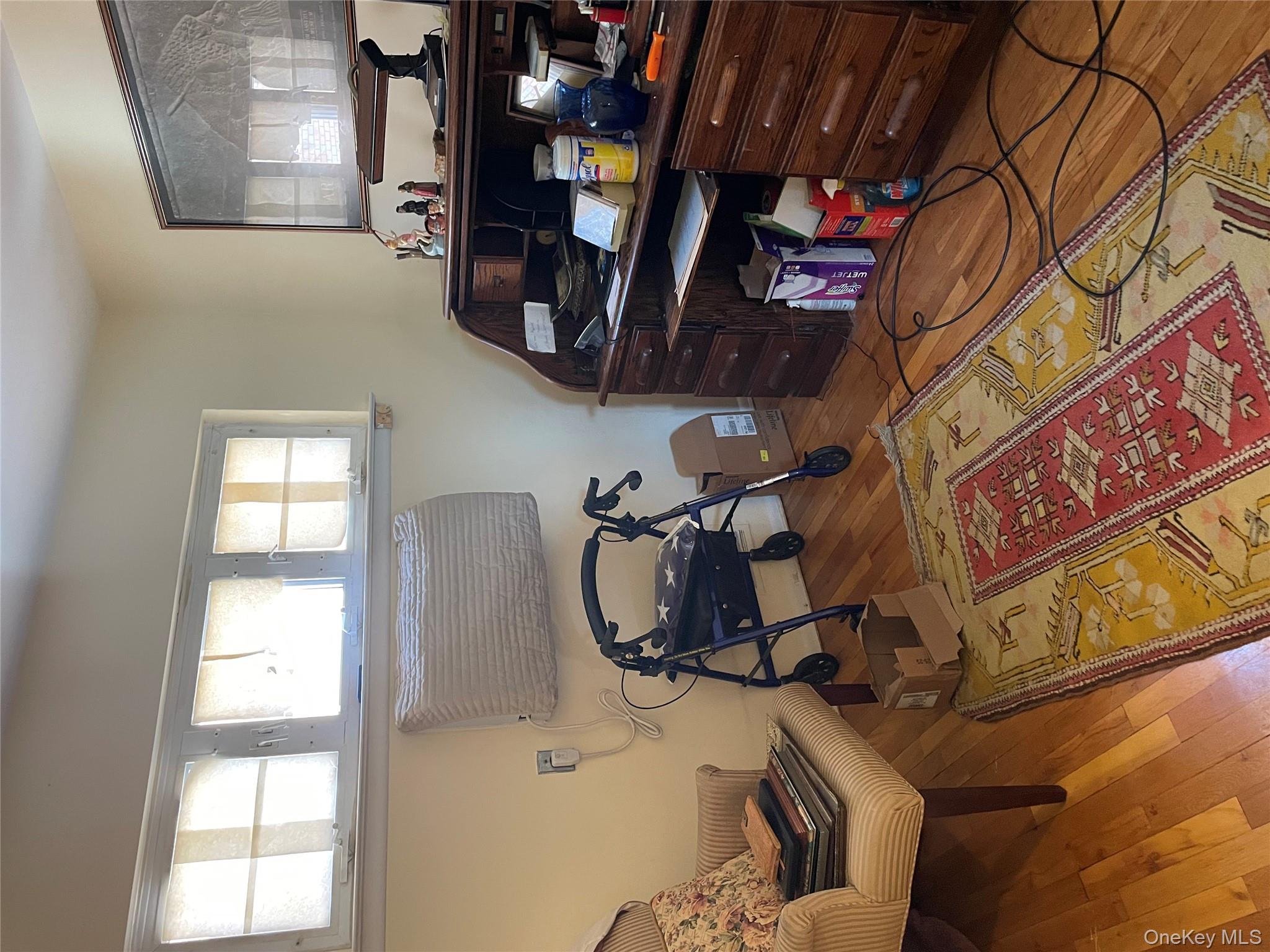 154-58 20th Road Queens, NY 11357 - Photo 14 of 27 a living room with furniture and a lamp