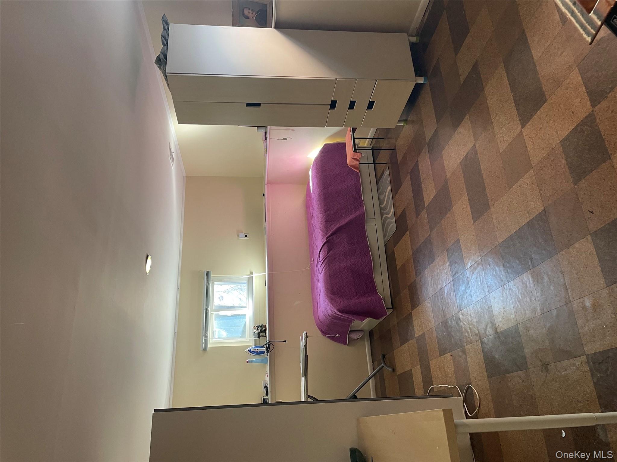 154-58 20th Road Queens, NY 11357 - Photo 15 of 27 a bedroom with a bed and a window