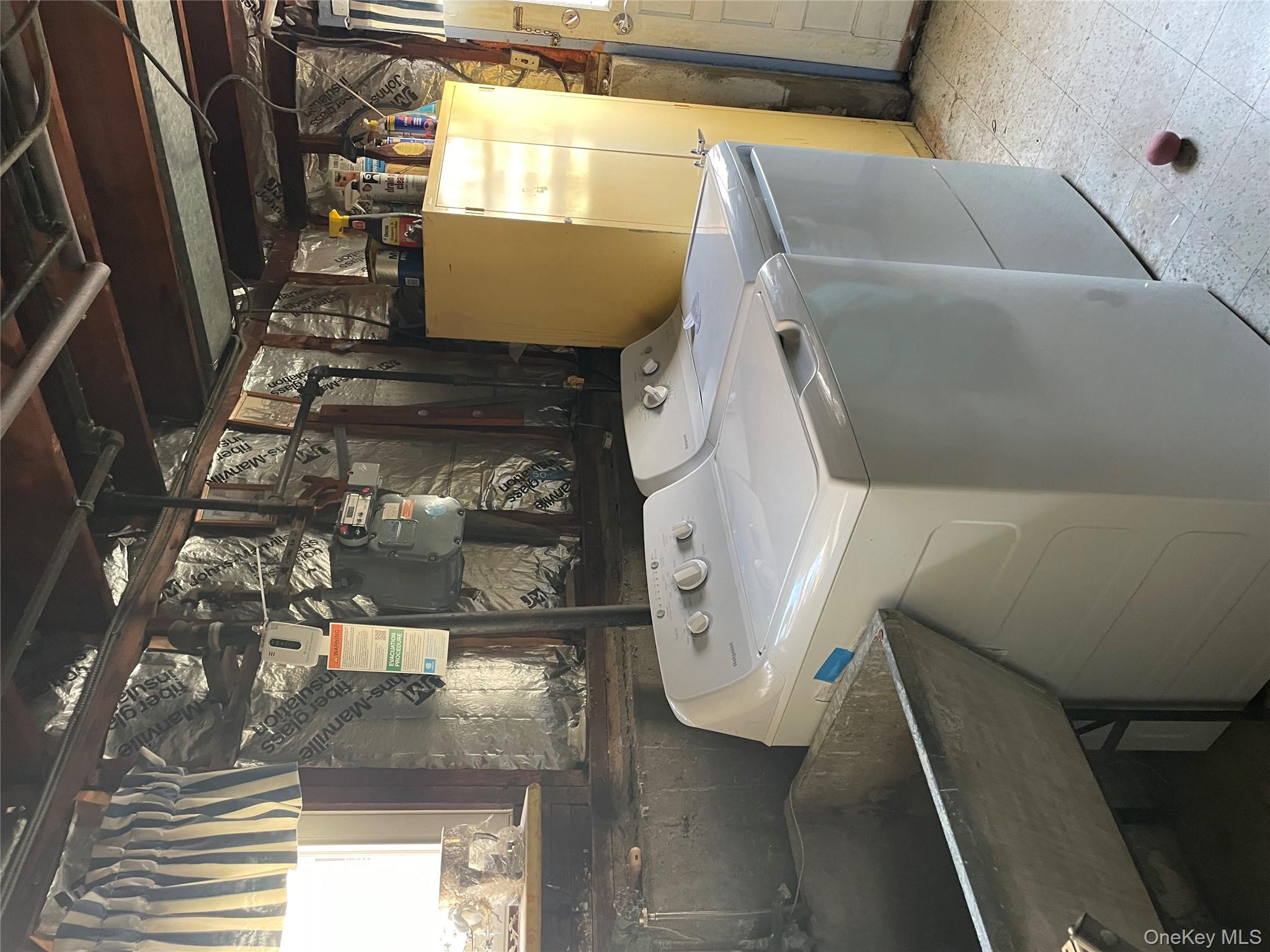 154-58 20th Road Queens, NY 11357 - Photo 17 of 27 a utility room with dryer and washer