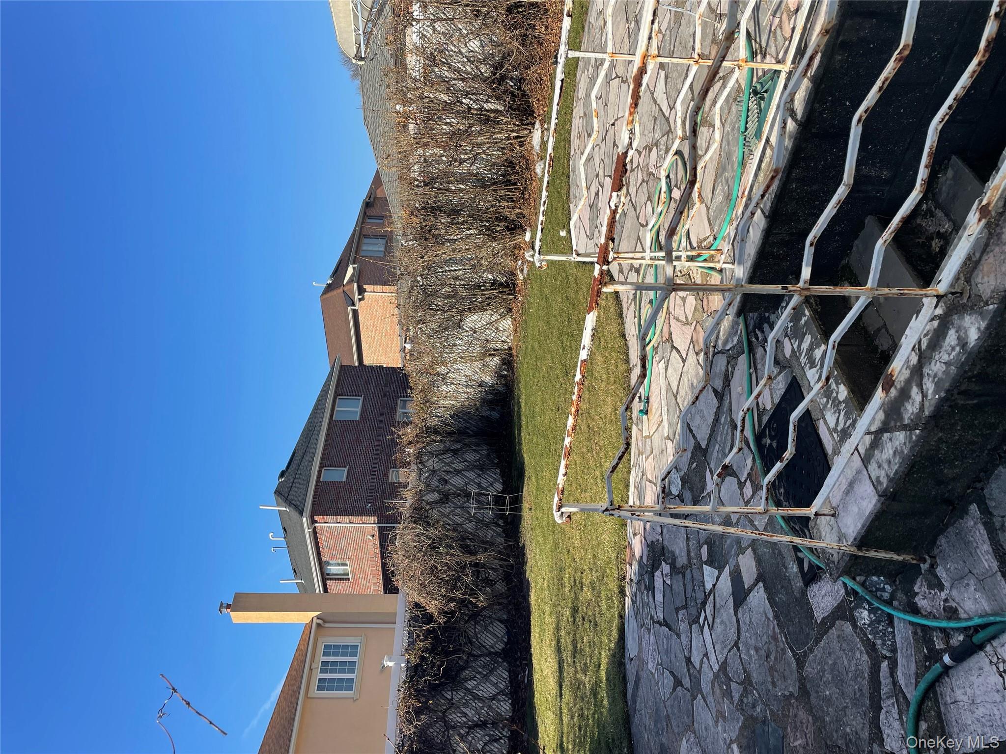 154-58 20th Road Queens, NY 11357 - Photo 19 of 27 a view of a swimming pool with a yard