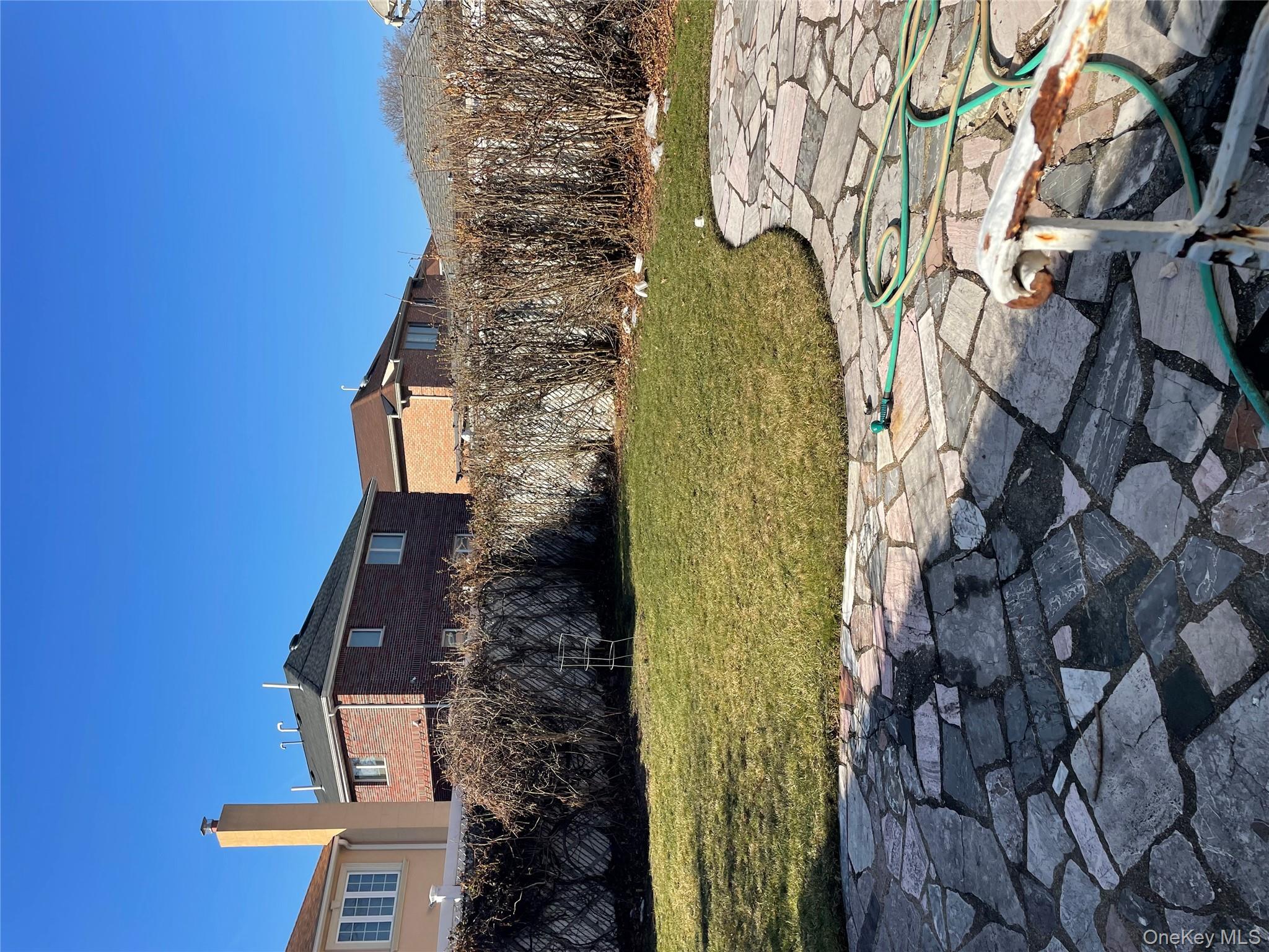 154-58 20th Road Queens, NY 11357 - Photo 20 of 27 a view of a lake with a house in the background