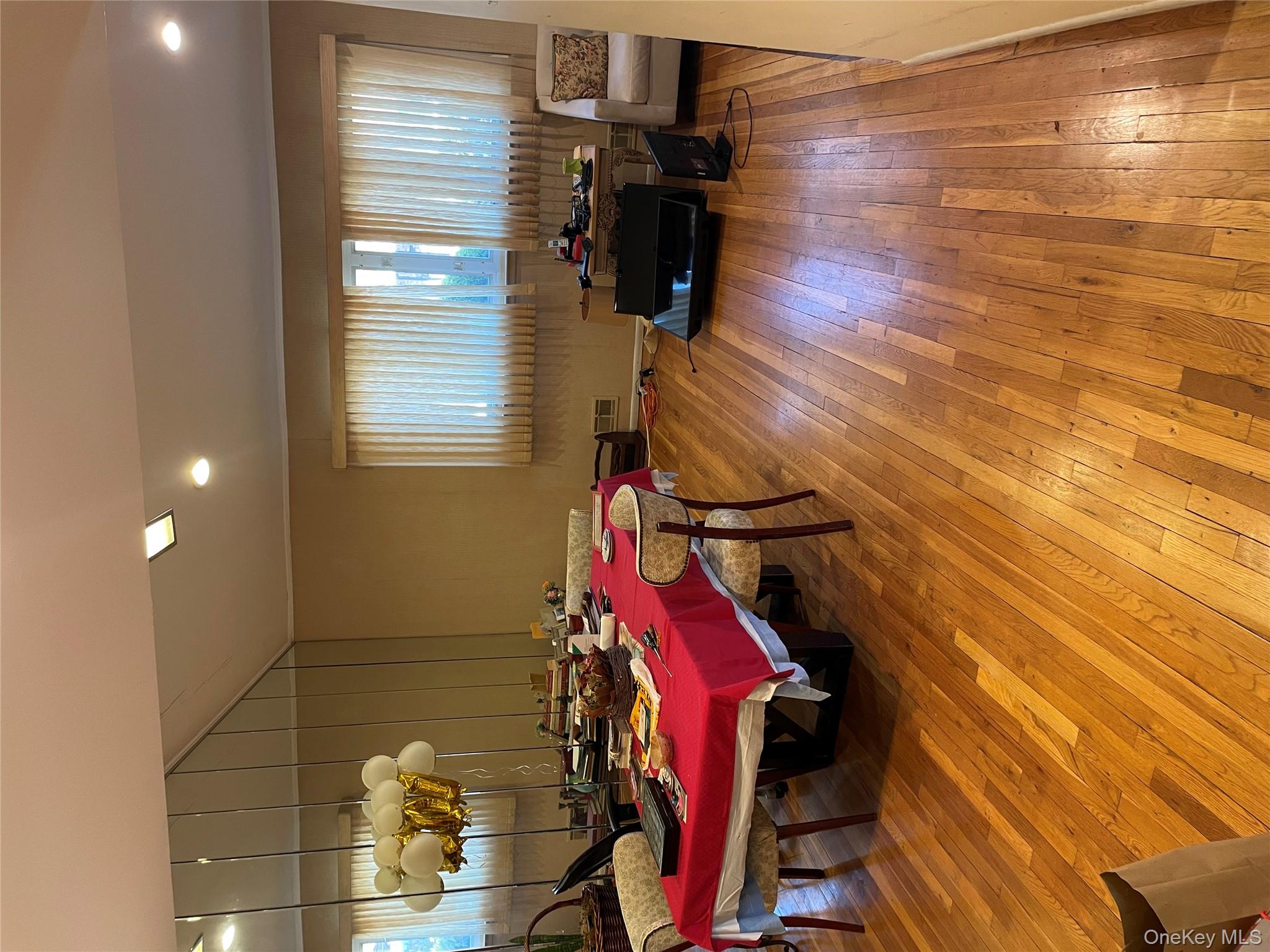 154-58 20th Road Queens, NY 11357 - Photo 7 of 27 a living room with furniture and wooden floor