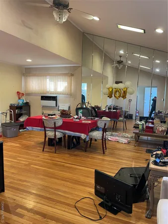 a room with gym equipment and a table
