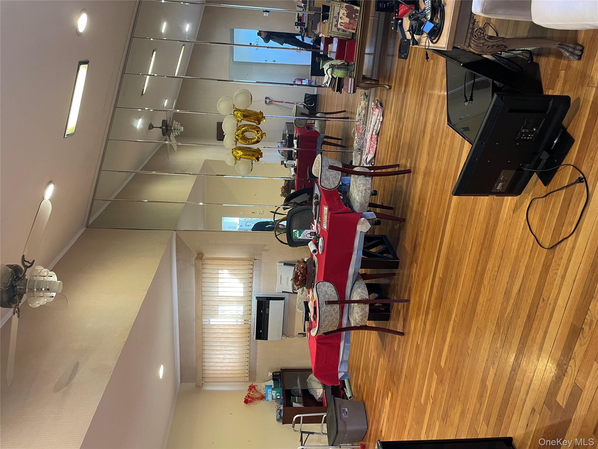 154-58 20th Road Queens, NY 11357 - Photo 9 of 27 a room with gym equipment and a table