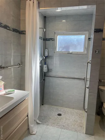 a bathroom with a sink and mirror