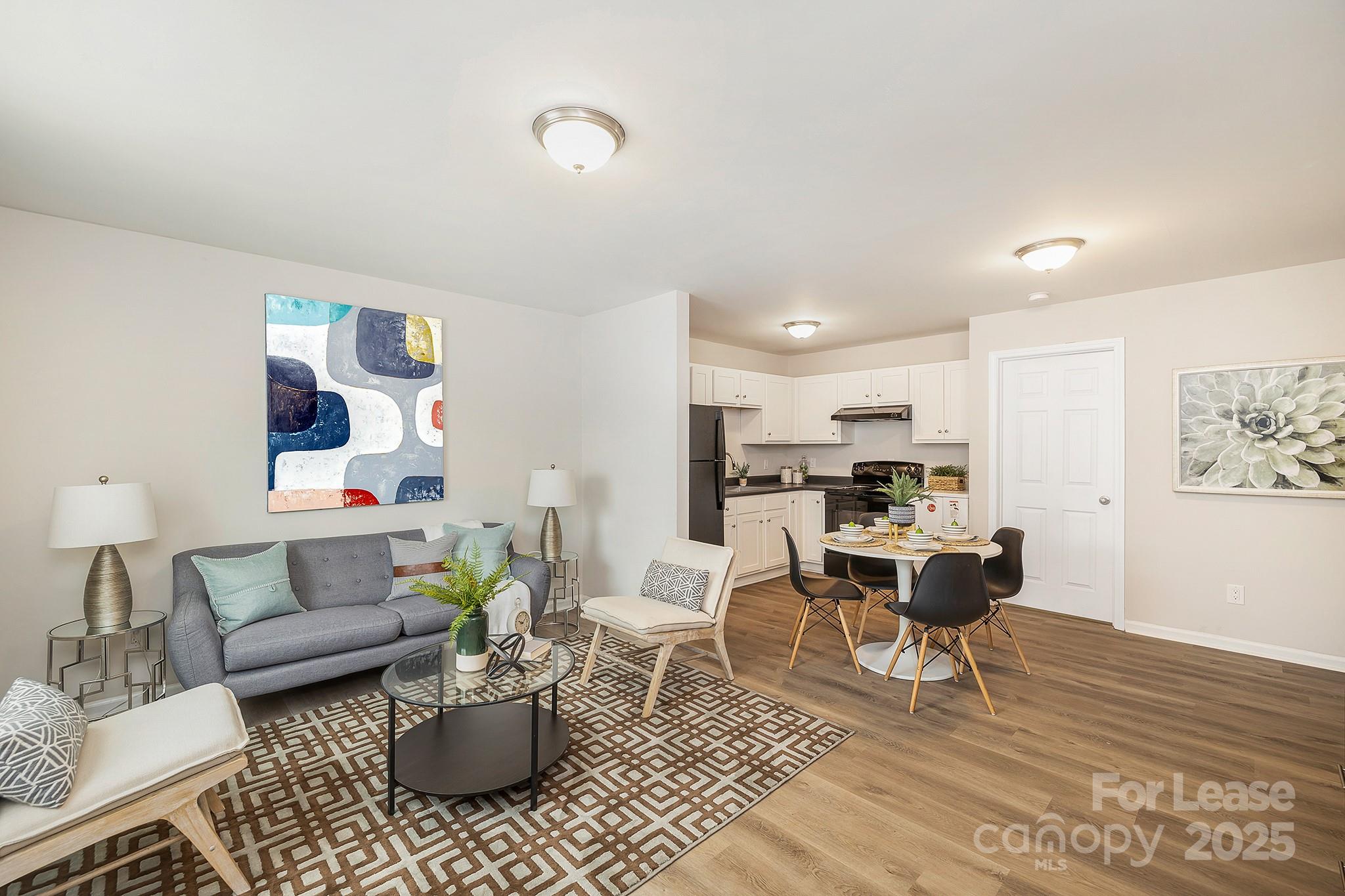 1850 Lowell Bethesda Road, Unit 2 Gastonia, NC 28056 - Photo 3 of 13 a living room with furniture or couch and a potted plant