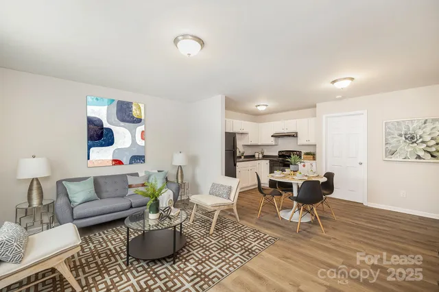 a living room with furniture or couch and a potted plant