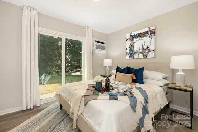 a bed room with a bed and a large window