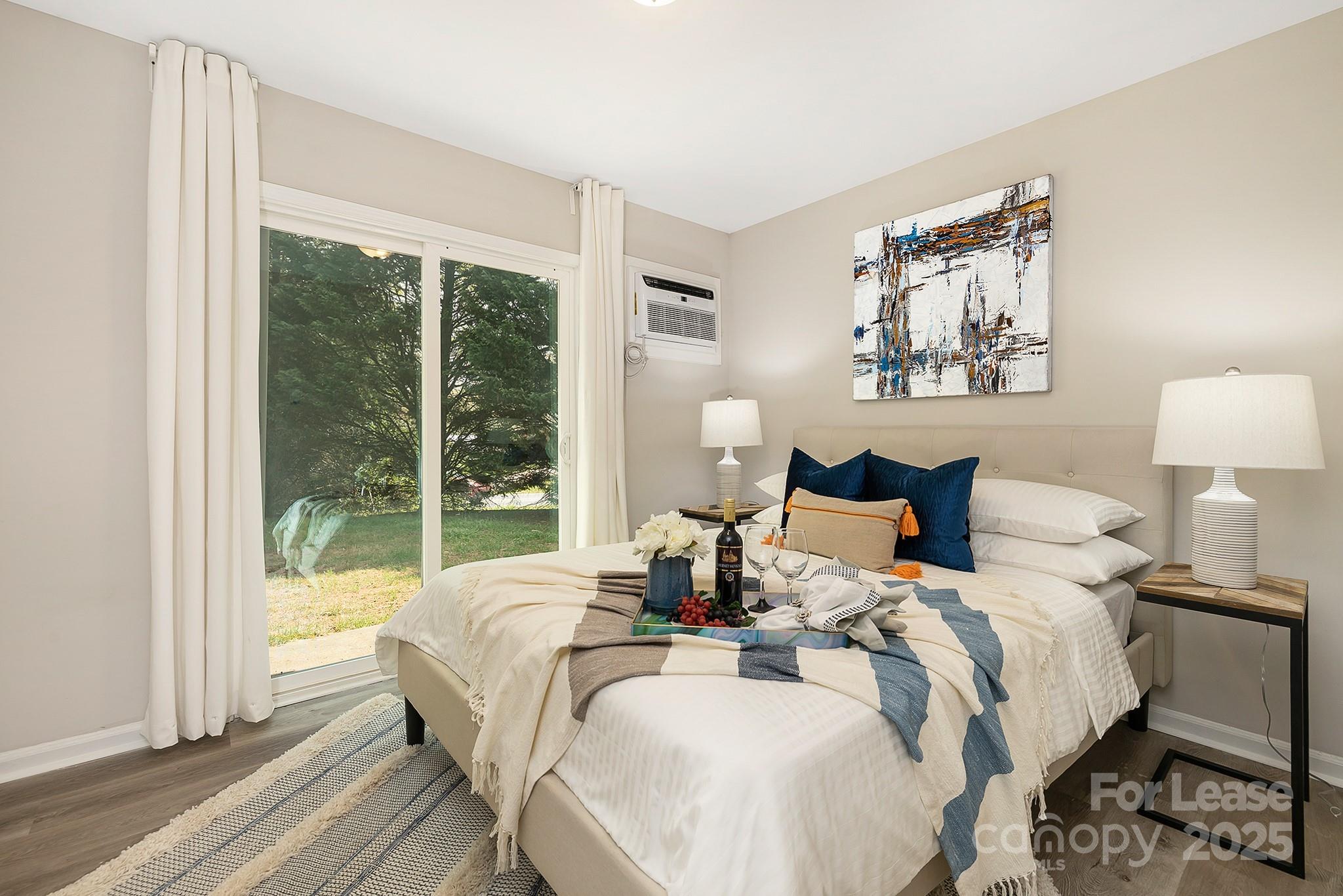 1850 Lowell Bethesda Road, Unit 2 Gastonia, NC 28056 - Photo 10 of 14 a bed room with a bed and a large window