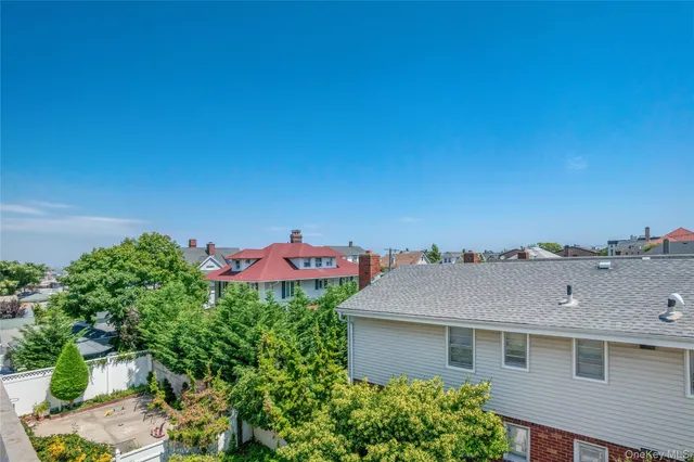 a aerial view of a house with a yard and garage