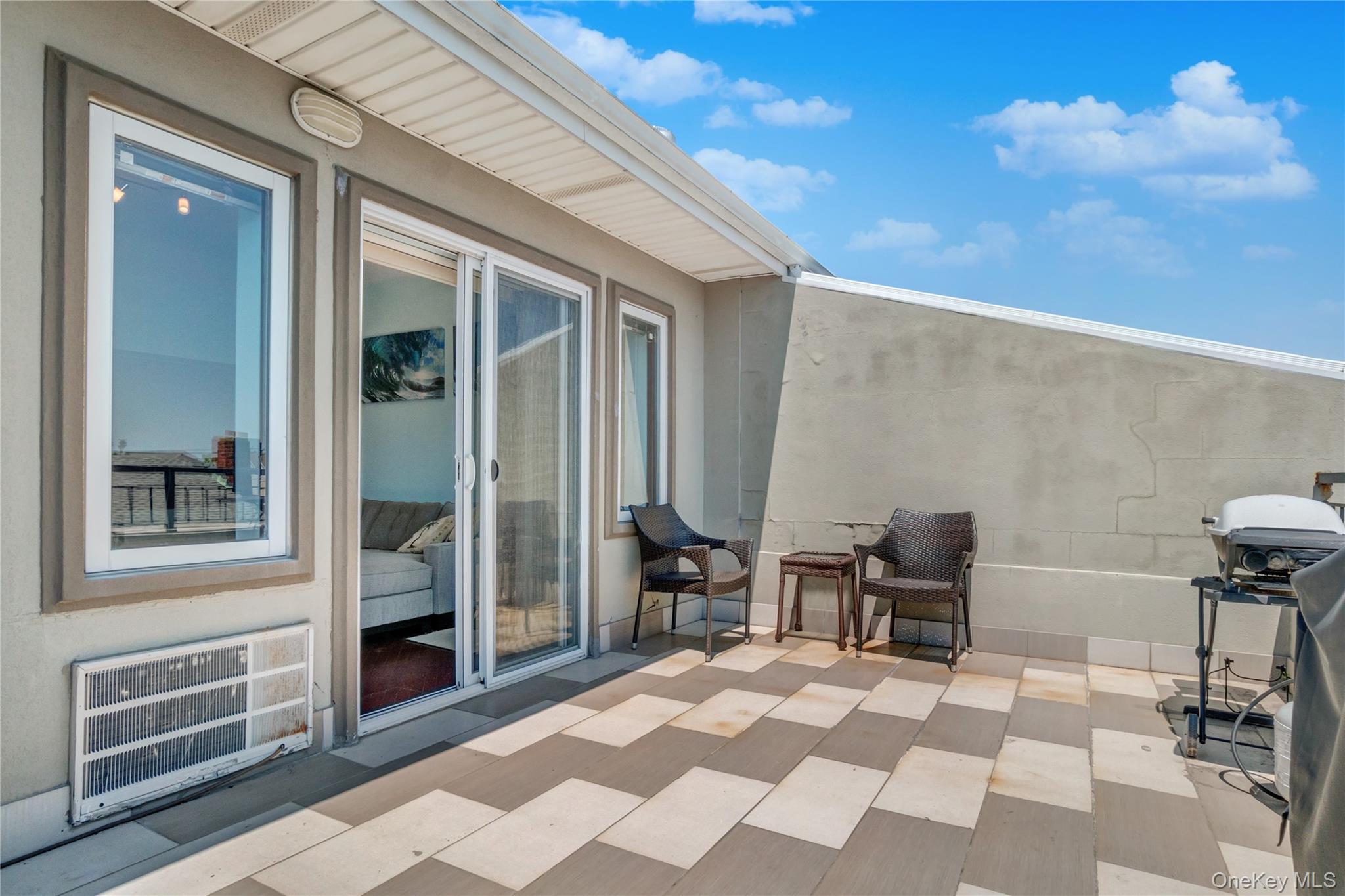 208 Beach 124th Street, Unit 6 Queens, NY 11694 - Photo 3 of 16 a outdoor space with chairs