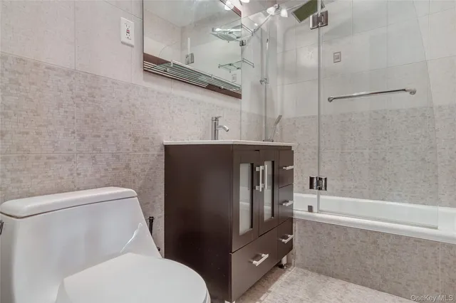 a bathroom with a toilet a sink and bathtub