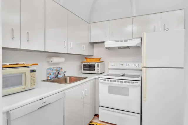 a bedroom that has a bed and a couch