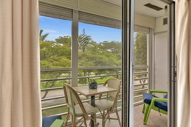 a view of a balcony with chairs