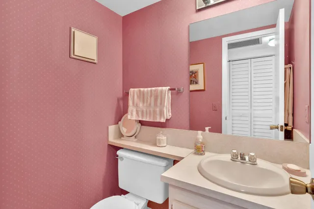 a dining room with furniture and a garden view