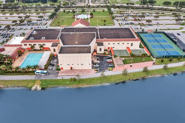 a front view of house with yard and outdoor seating