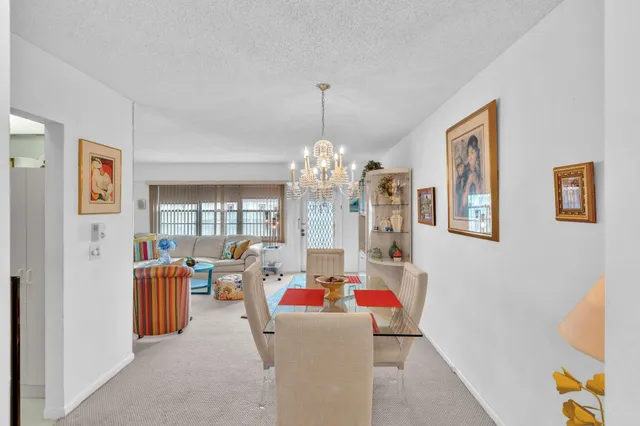 a kitchen with cabinets and white appliances