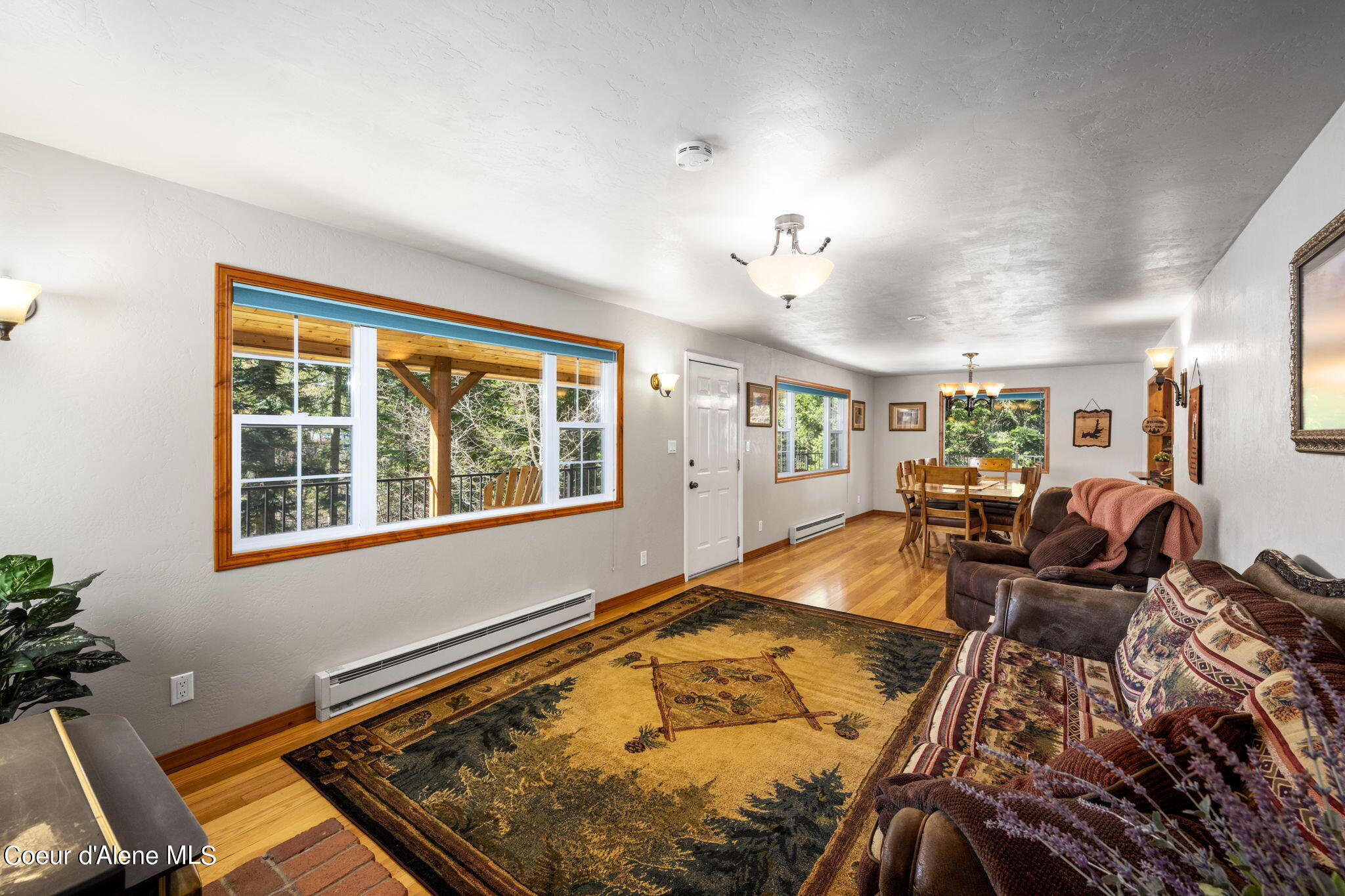 19503 East Hayden Lake Road Hayden, ID 83835 - Photo 21 of 57 living room into dining room