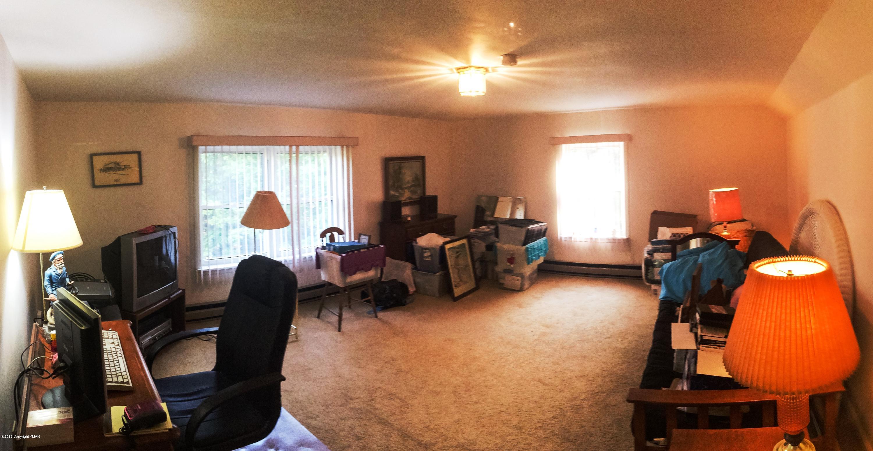 154 Upper Notch Road Albrightsville, PA 18210 - Photo 11 of 25 a view of a livingroom with furniture and a window