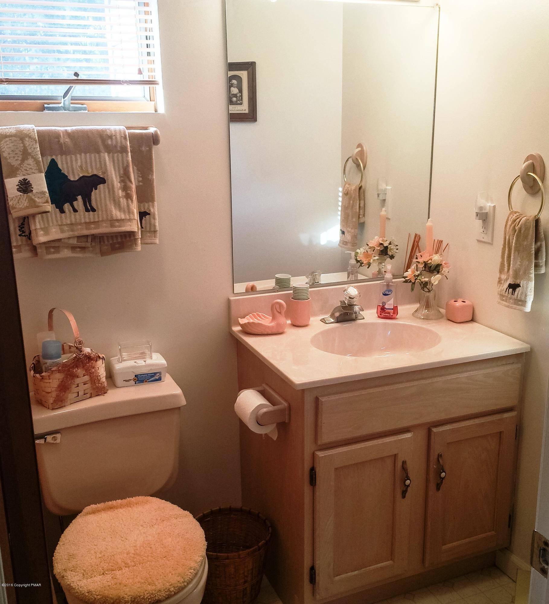 154 Upper Notch Road Albrightsville, PA 18210 - Photo 14 of 25 a bathroom with a sink a toilet and a mirror