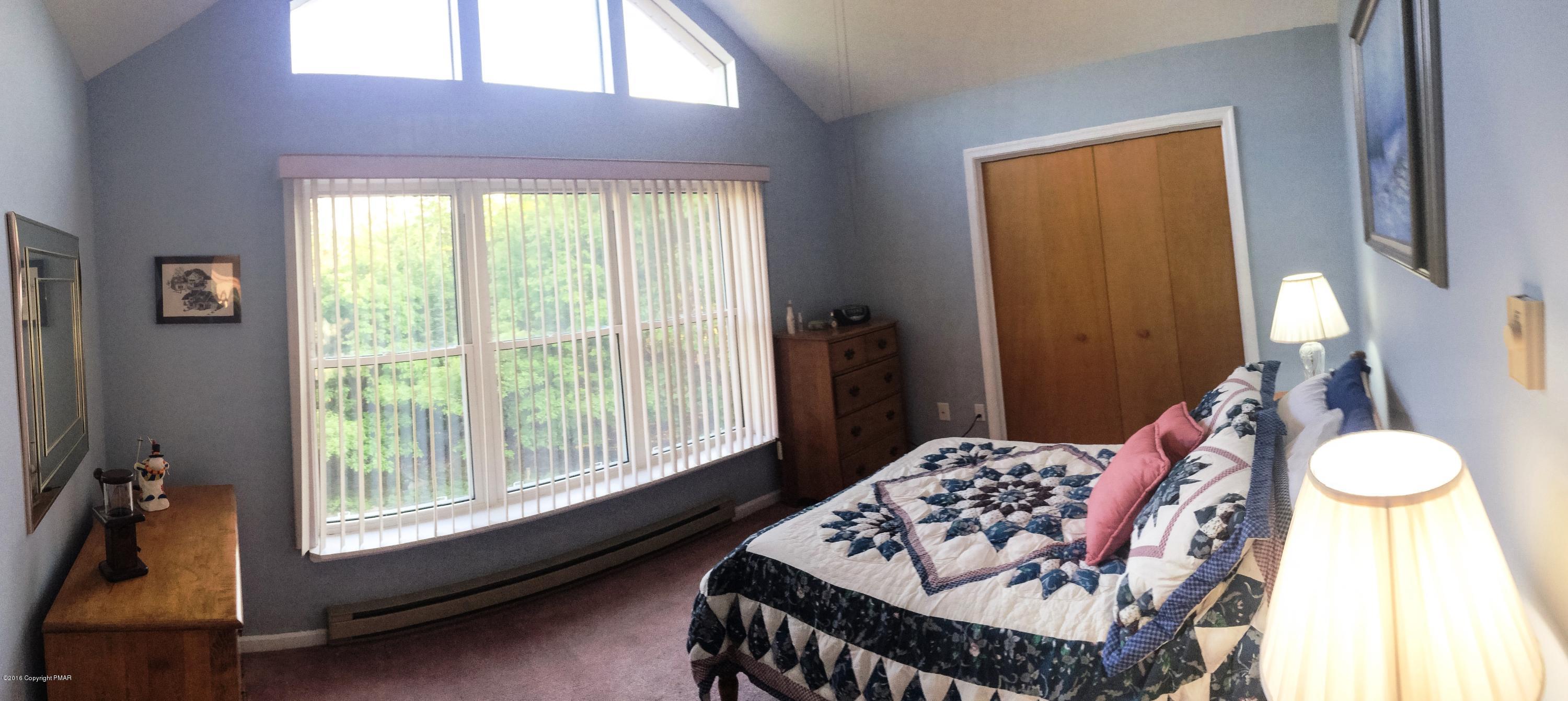 154 Upper Notch Road Albrightsville, PA 18210 - Photo 10 of 25 a bedroom with a bed and a large window