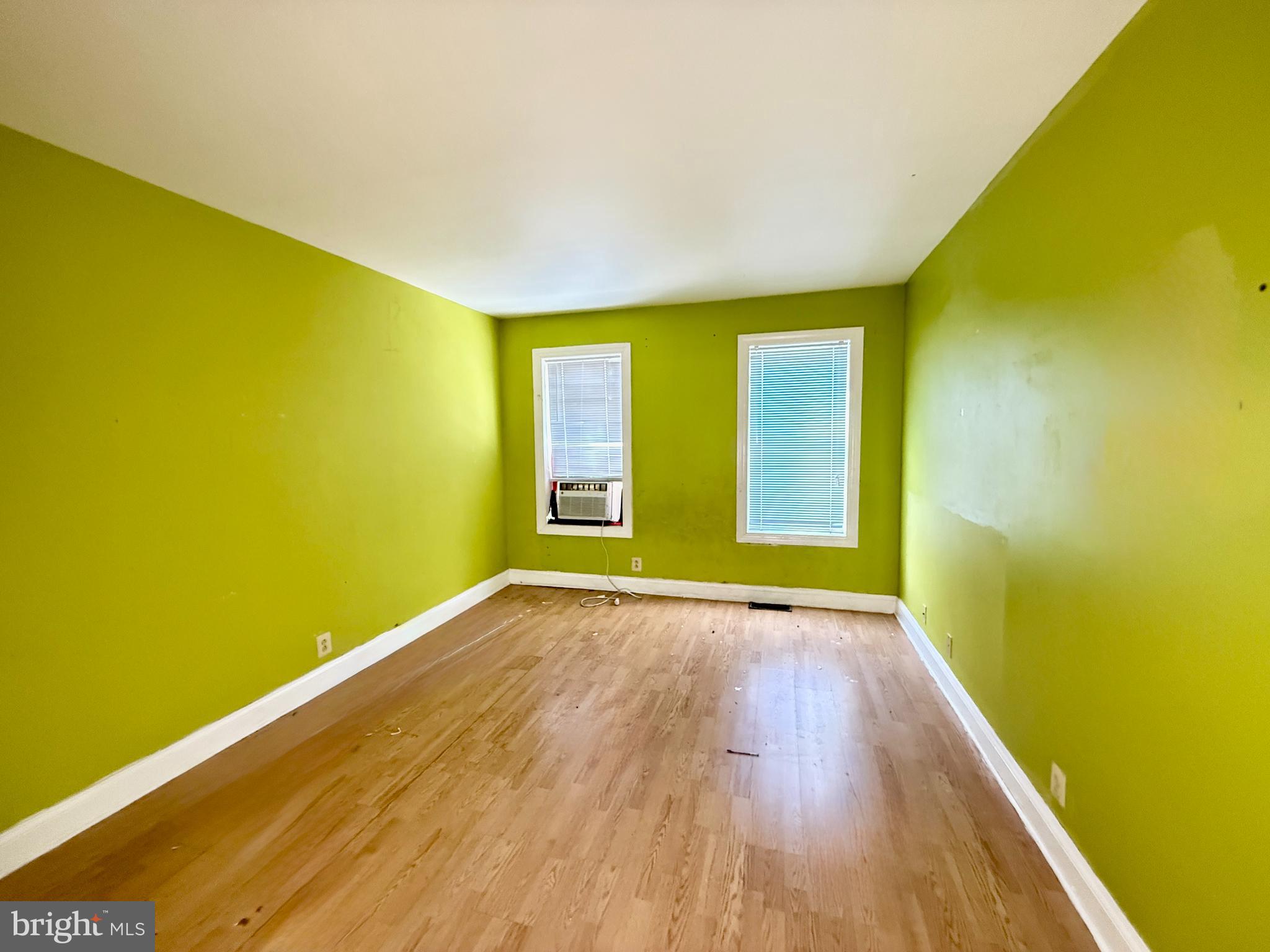 321 South Newkirk Street Baltimore, MD 21224 - Photo 8 of 8 a view of empty room with wooden floor and fan