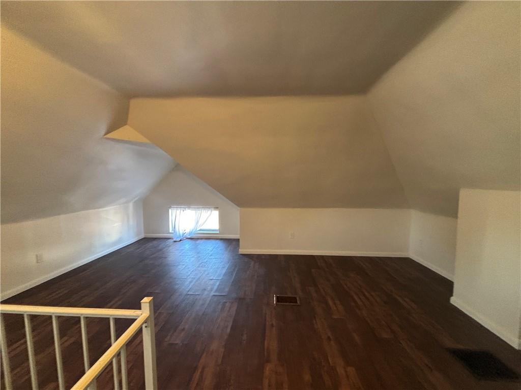 364 Ohio Avenue, Unit 2 Rochester, PA 15074 - Photo 12 of 16 a view of an empty room with wooden floor and a window