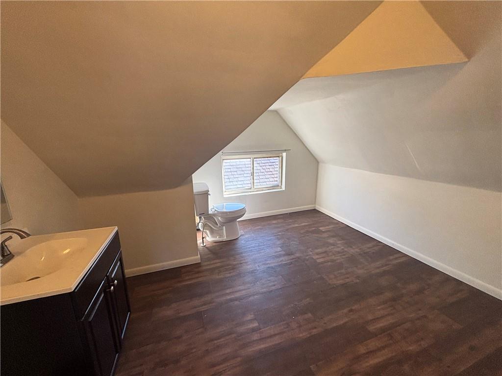 364 Ohio Avenue, Unit 2 Rochester, PA 15074 - Photo 13 of 16 wooden floor in an empty room with a window