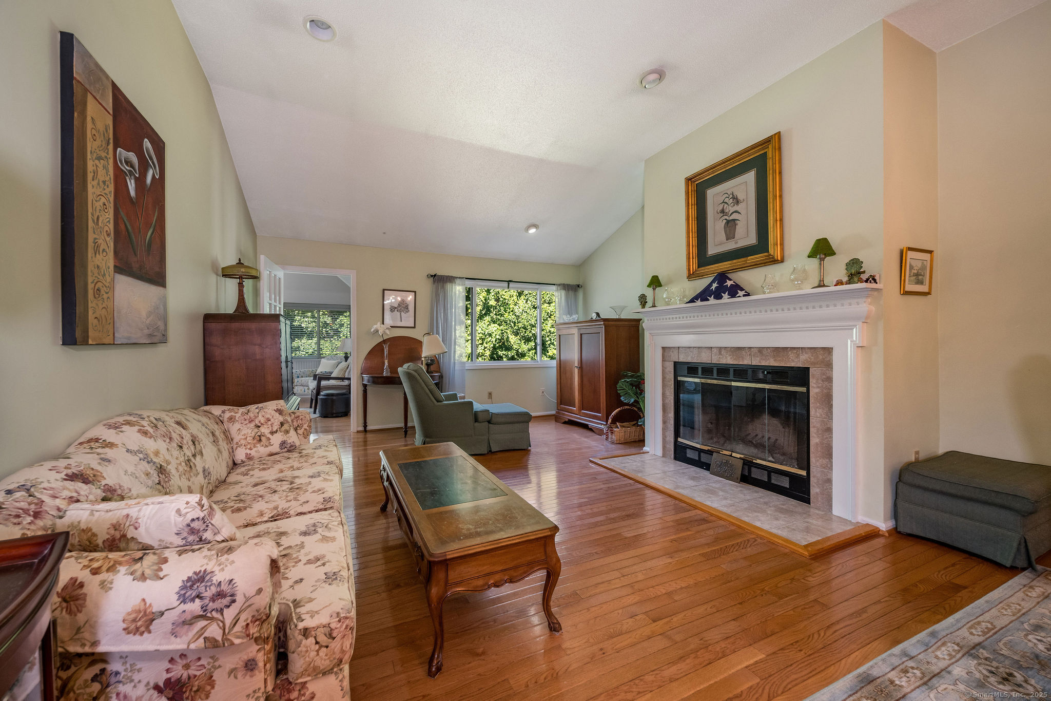 40 Legend Hill Road, Unit 40 Madison, CT 06443 - Photo 11 of 29 a living room with furniture and a fireplace