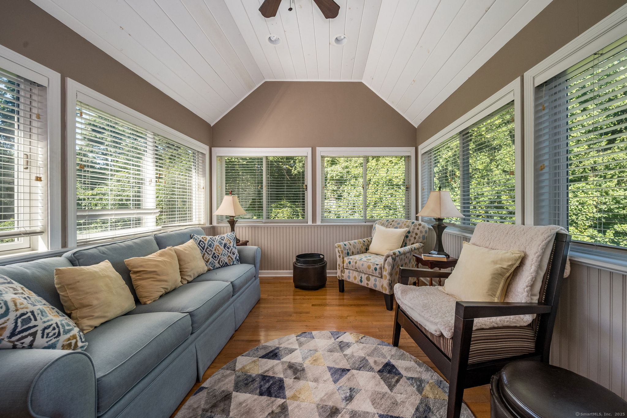 40 Legend Hill Road, Unit 40 Madison, CT 06443 - Photo 14 of 29 a living room with furniture and large windows