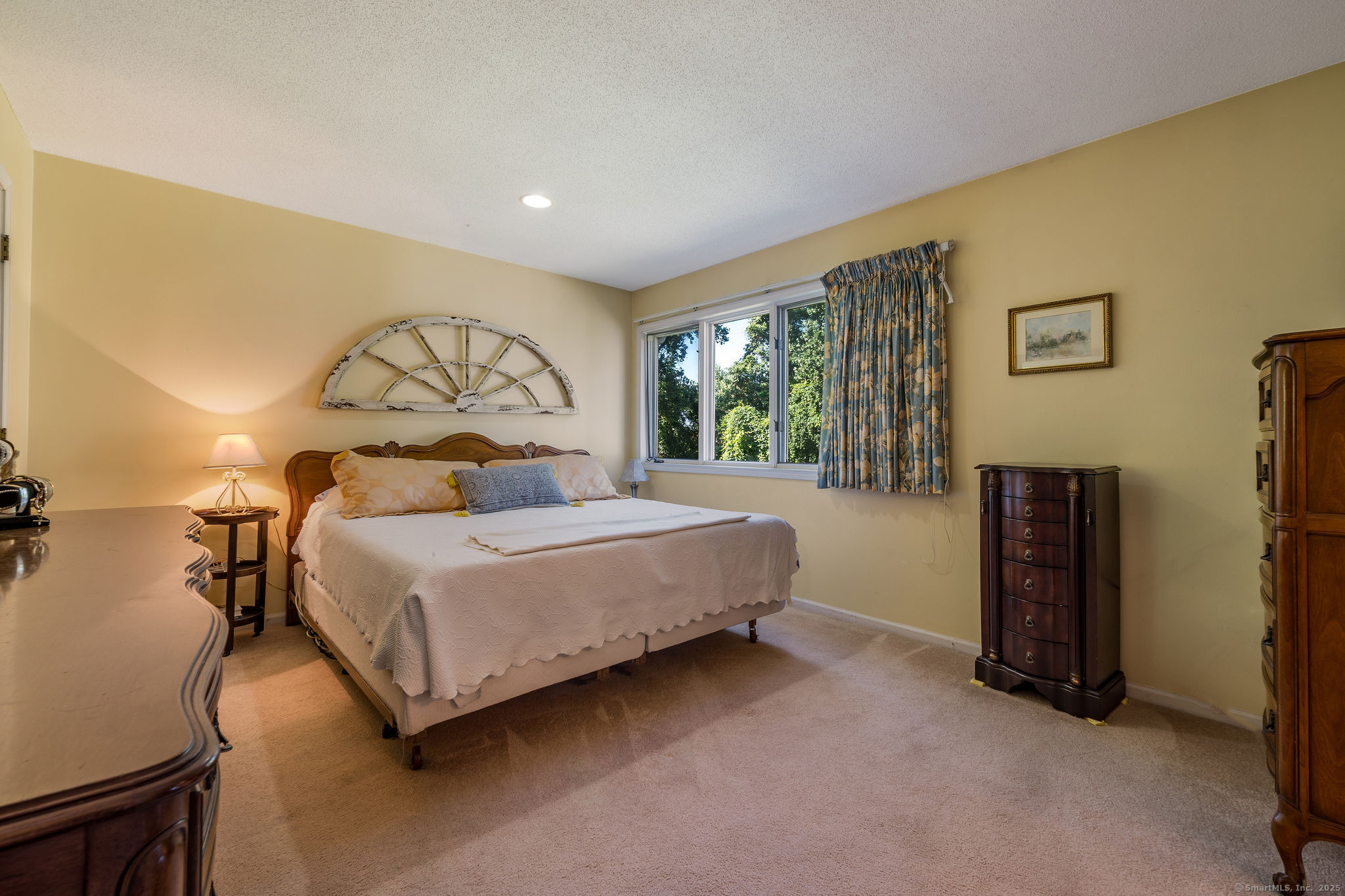 40 Legend Hill Road, Unit 40 Madison, CT 06443 - Photo 15 of 29 a bedroom with a bed and a flat screen tv