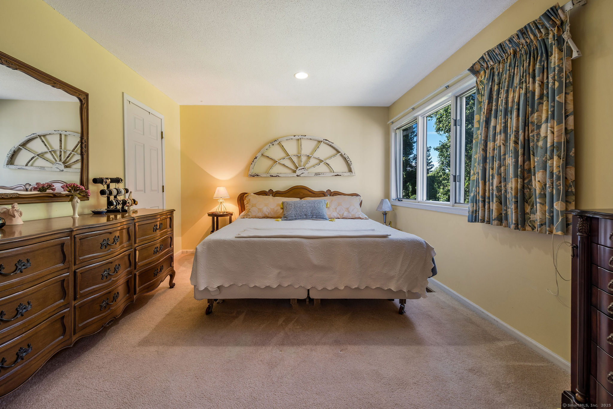 40 Legend Hill Road, Unit 40 Madison, CT 06443 - Photo 16 of 29 a bedroom with a bed and a dresser