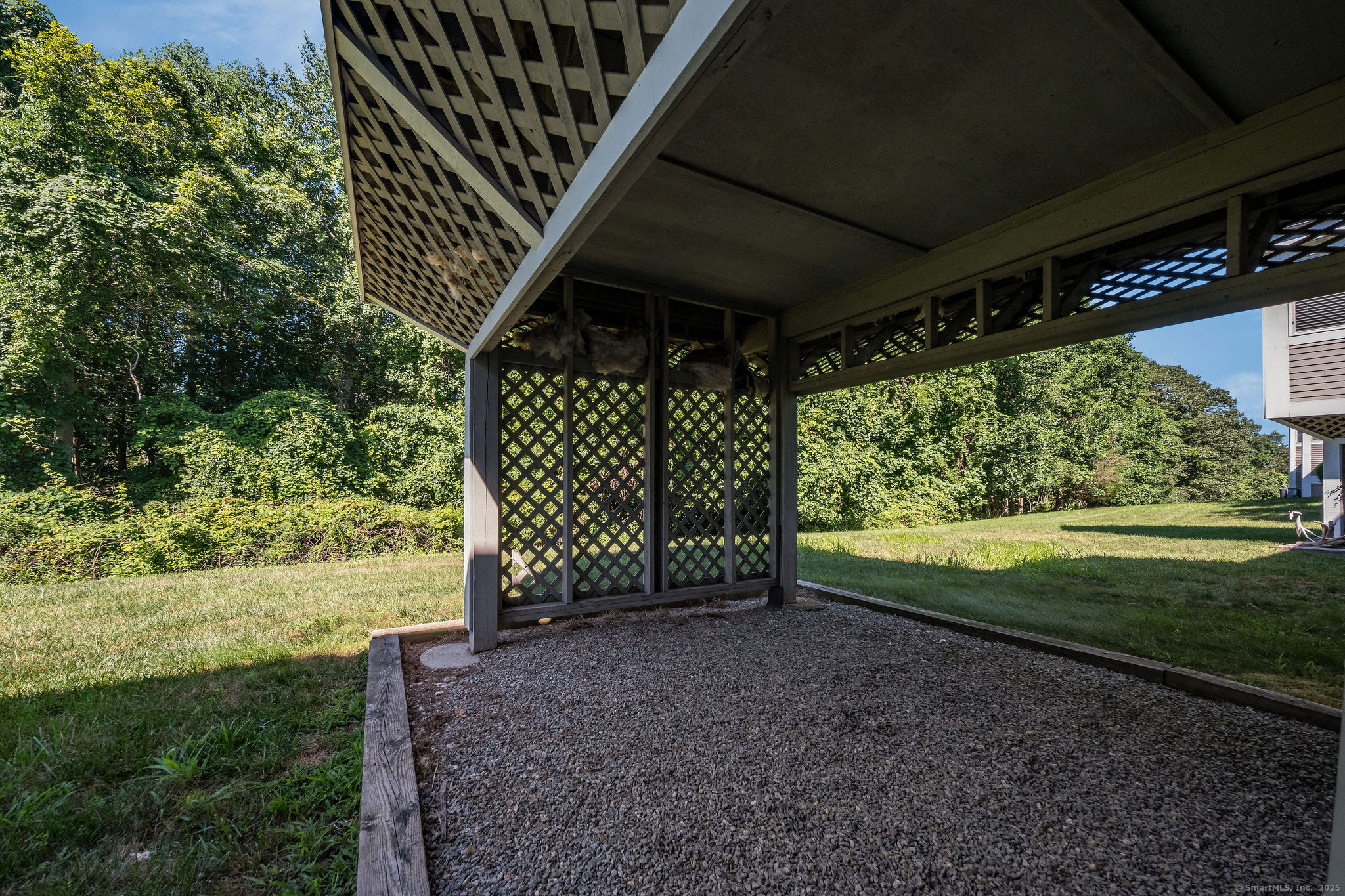 40 Legend Hill Road, Unit 40 Madison, CT 06443 - Photo 24 of 29 a view of a backyard with wooden fence