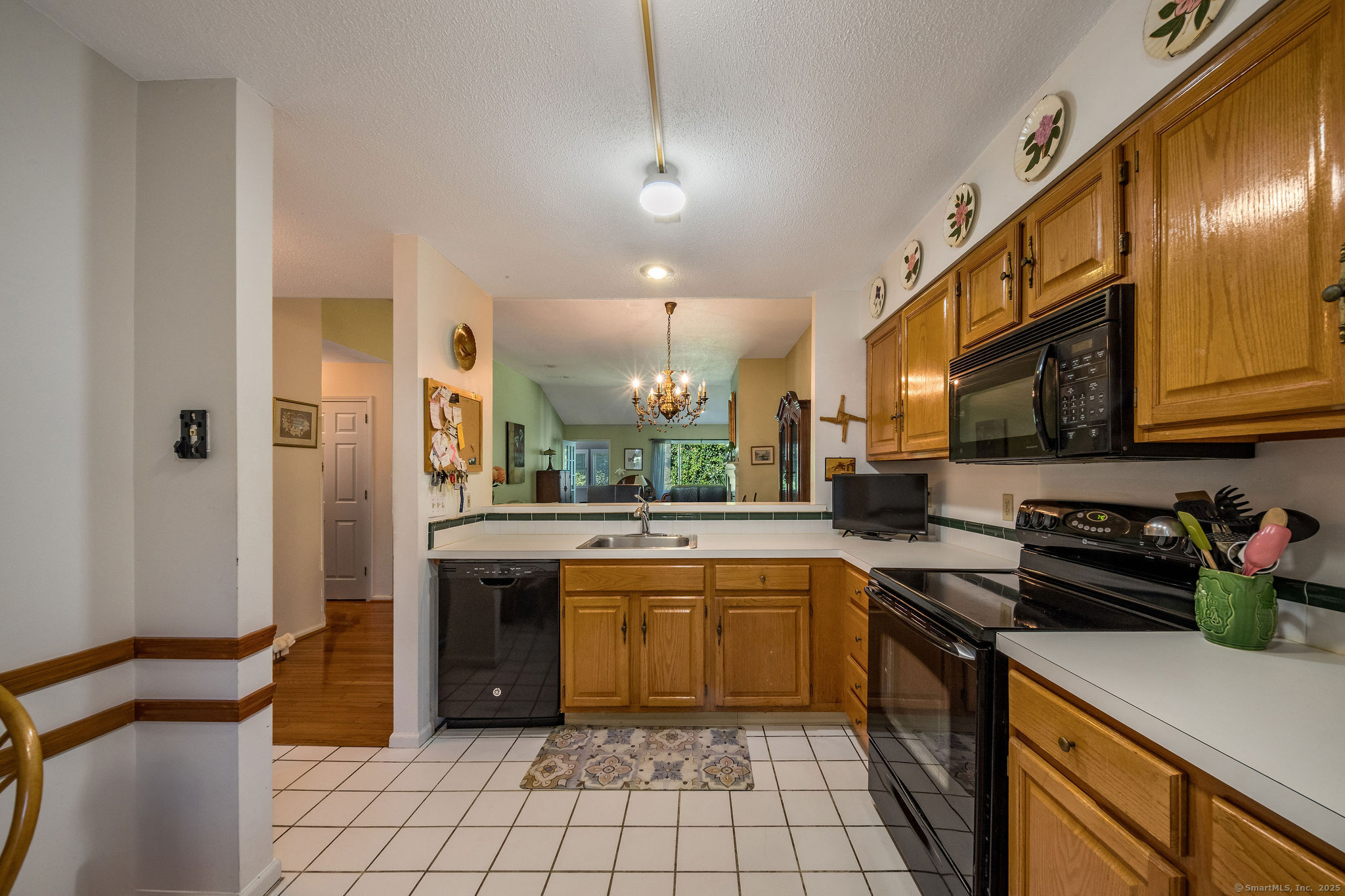40 Legend Hill Road, Unit 40 Madison, CT 06443 - Photo 6 of 29 a kitchen with a sink cabinets and window