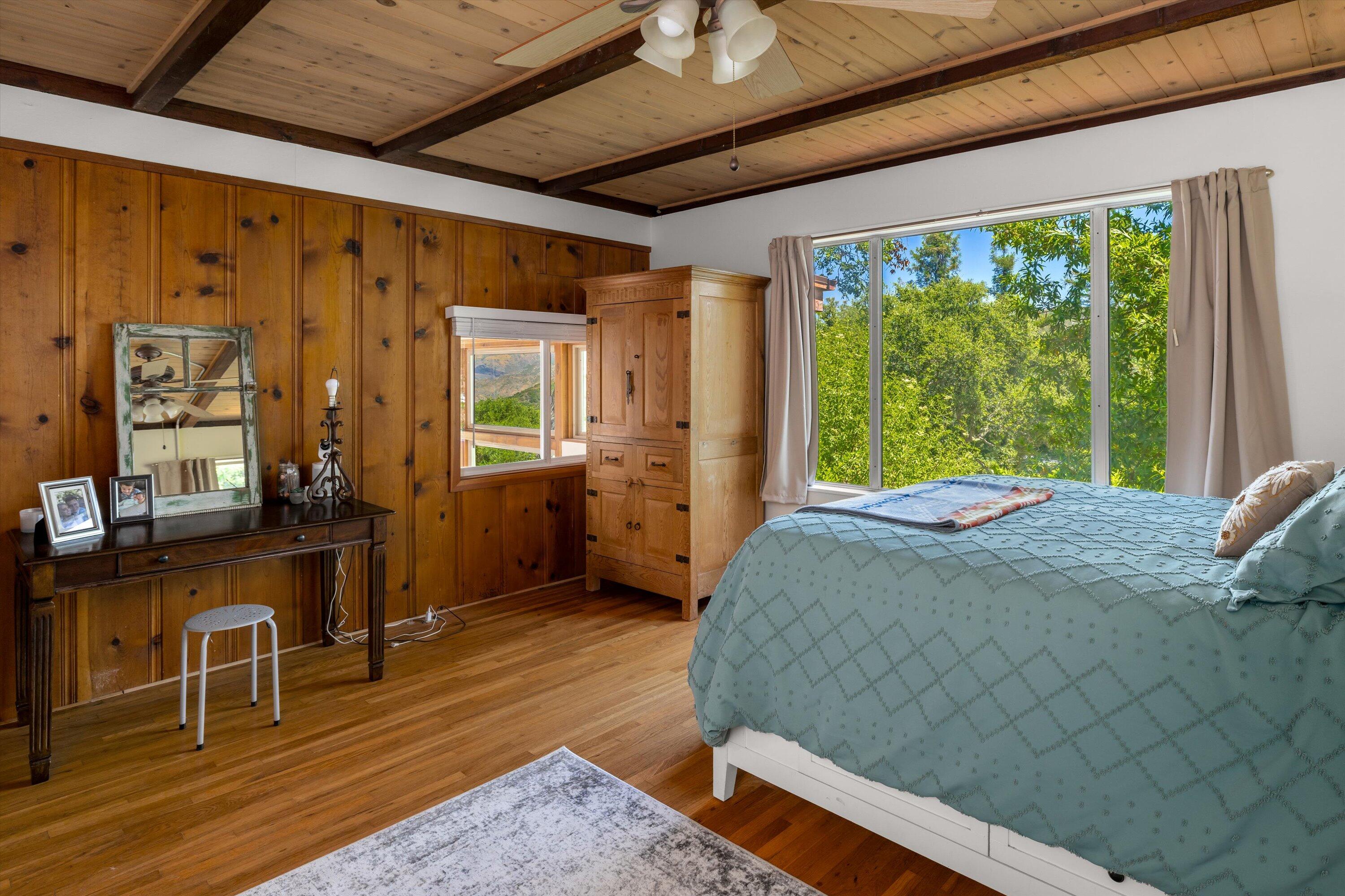 279 Rosario Park Road Santa Barbara, CA 93105 - Photo 19 of 49 a bed sitting in a spacious bedroom next to a window