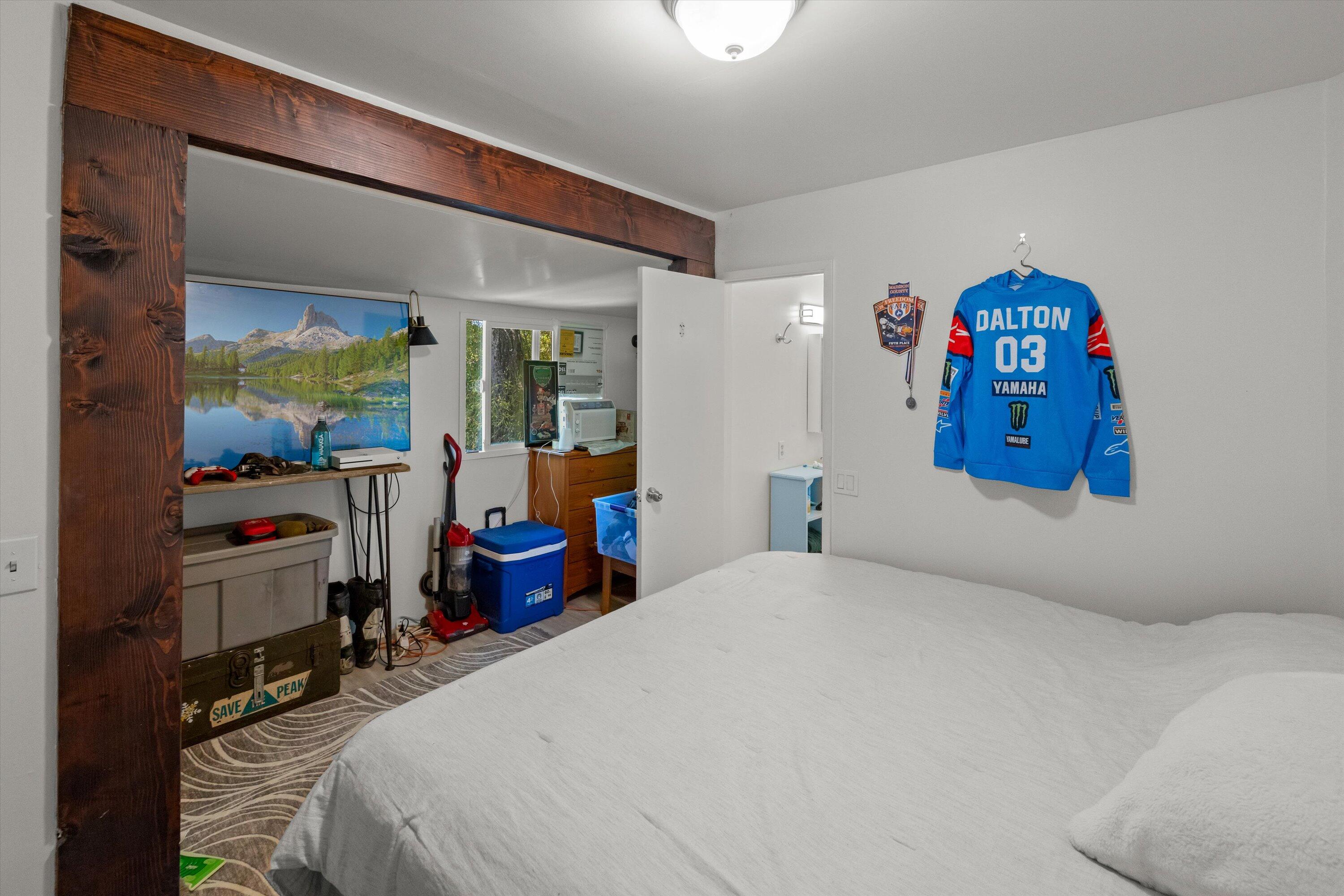 279 Rosario Park Road Santa Barbara, CA 93105 - Photo 37 of 49 a bedroom with a large bed and a large mirror with window