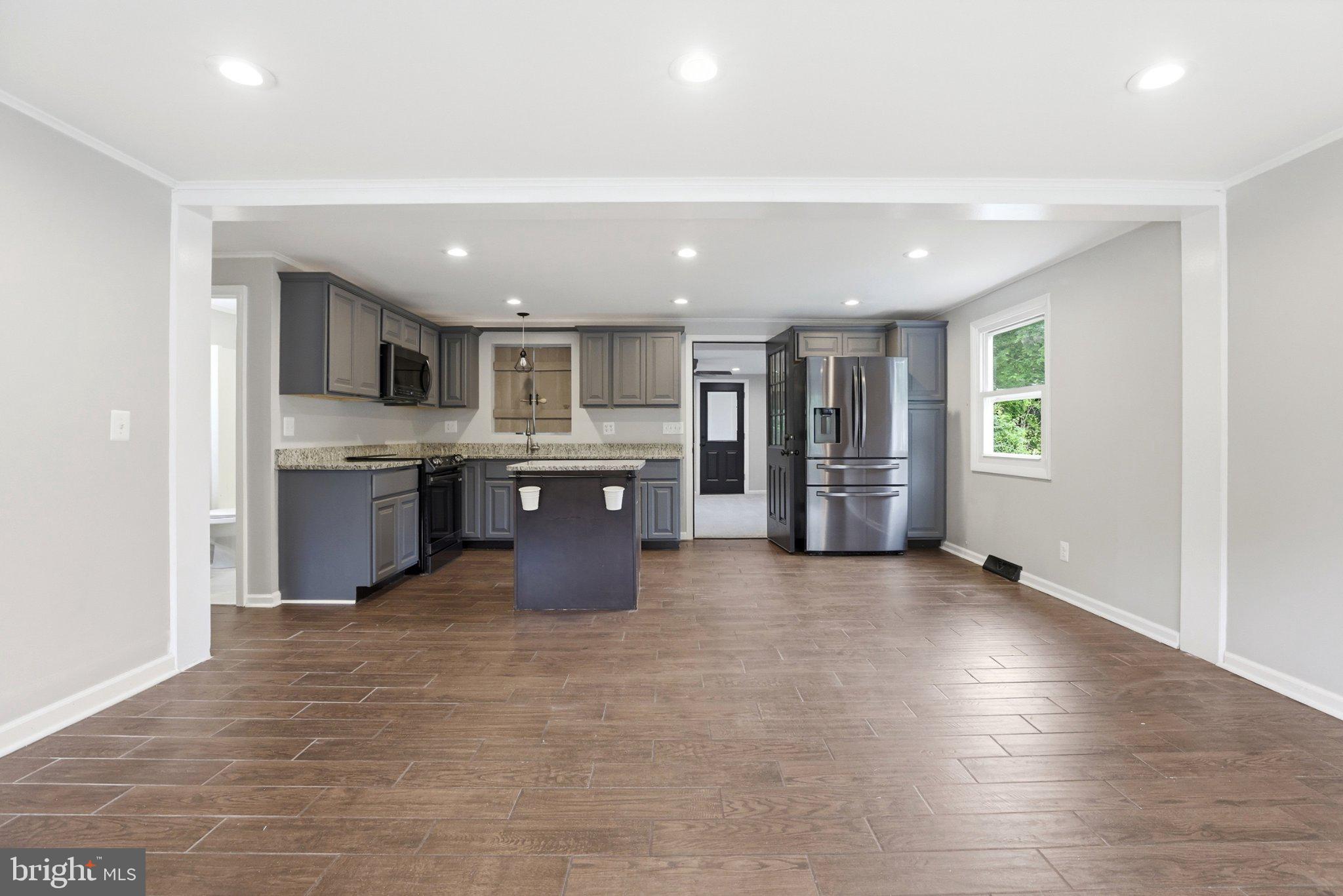 941 Pat Lane Huntingtown, MD 20639 - Photo 6 of 30 Modern kitchen with open layout charm.