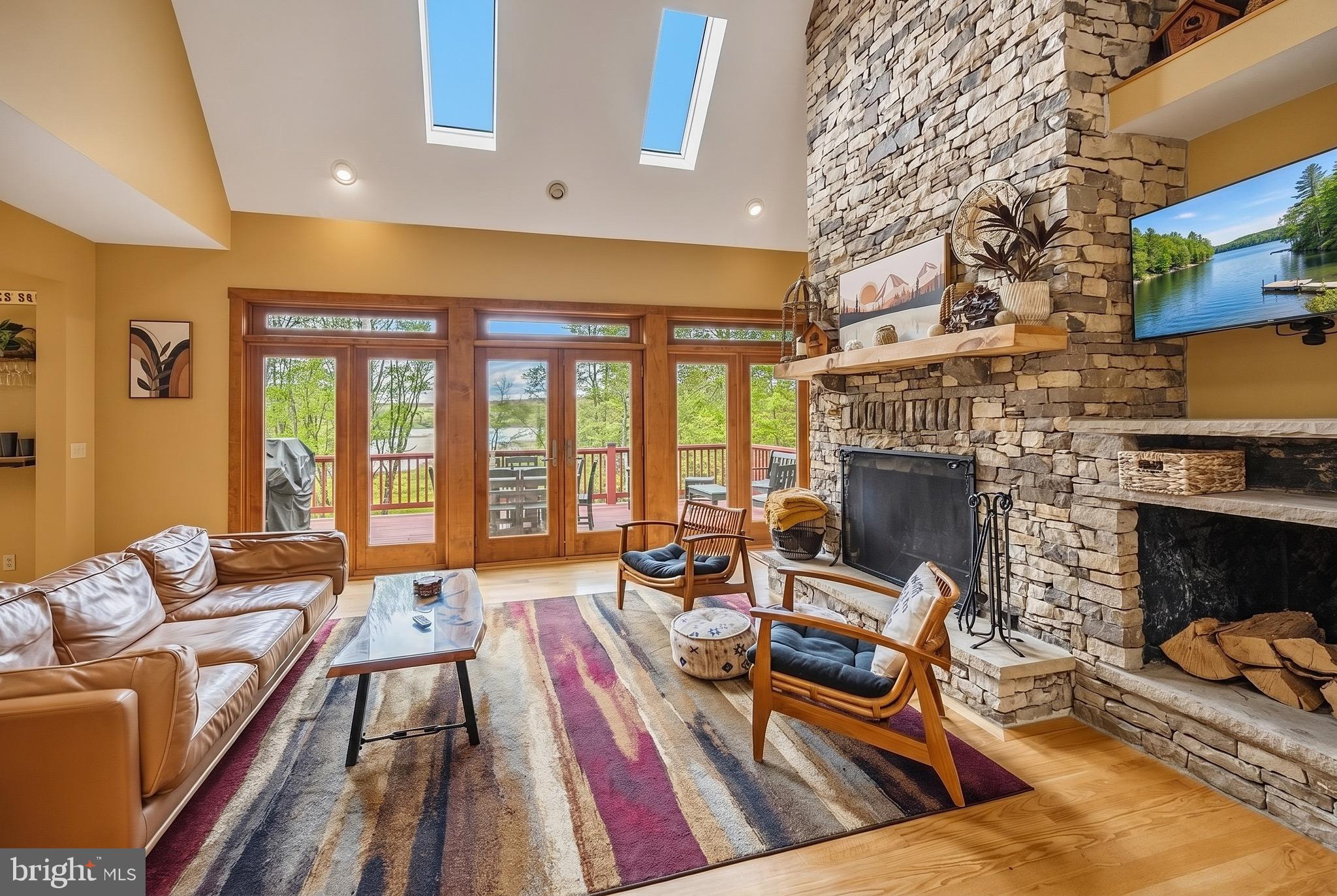 185 Ruta Lane Swanton, MD 21561 - Photo 4 of 81 a living room with furniture fireplace and flat screen tv