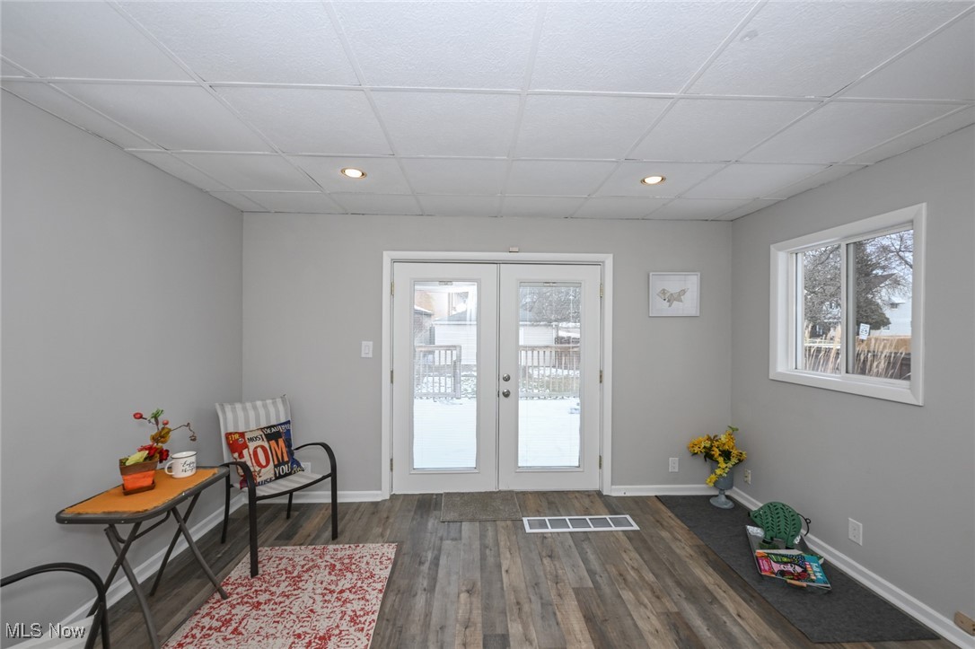1164 Copley Road Akron, OH 44320 - Photo 22 of 50 Entryway with baseboards, visible vents, dark wood-style flooring, and french doors