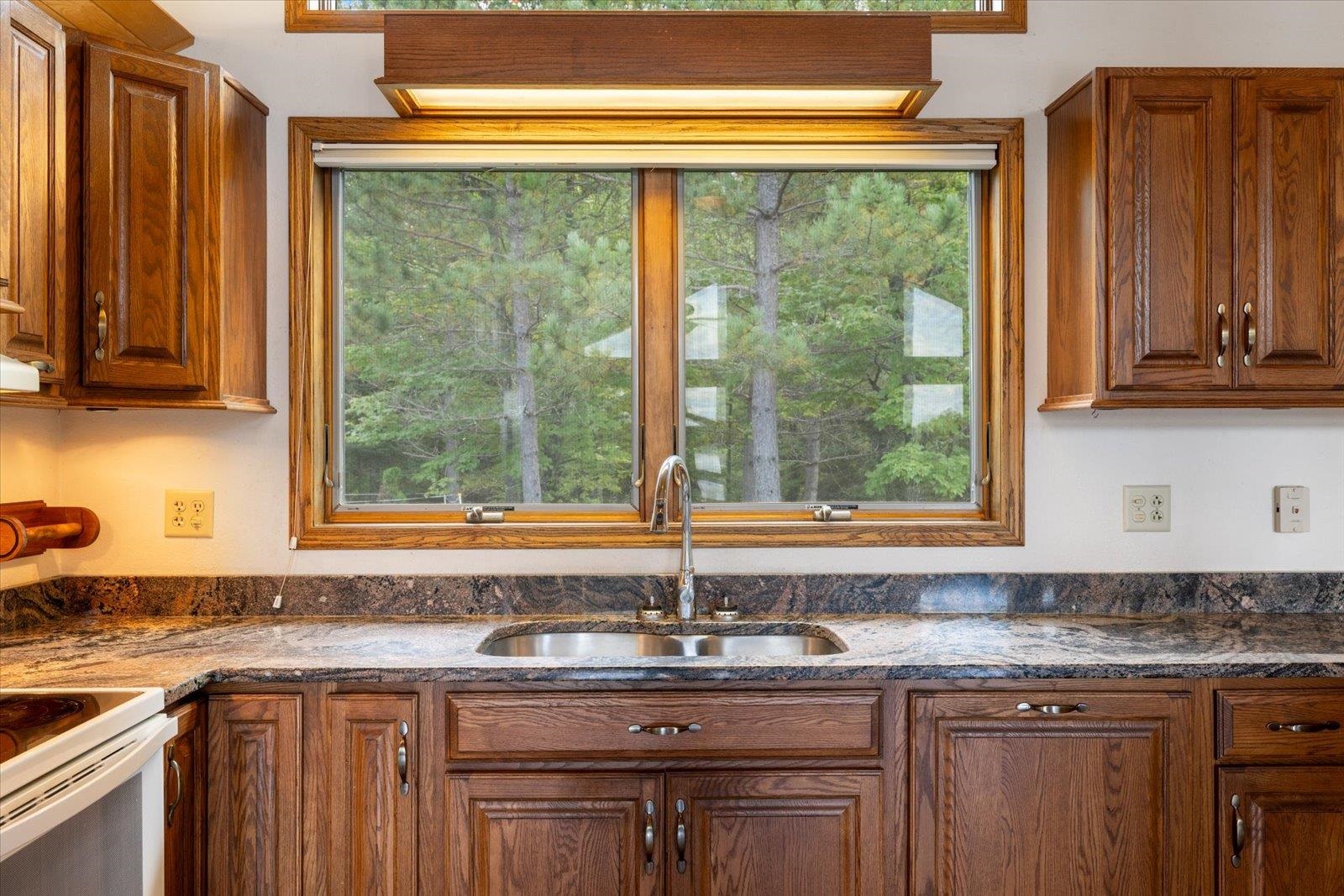 2375 Viste Point Road Ely, MN 55731 - Photo 20 of 83 Kitchen with wood cabinets, and stone countertops