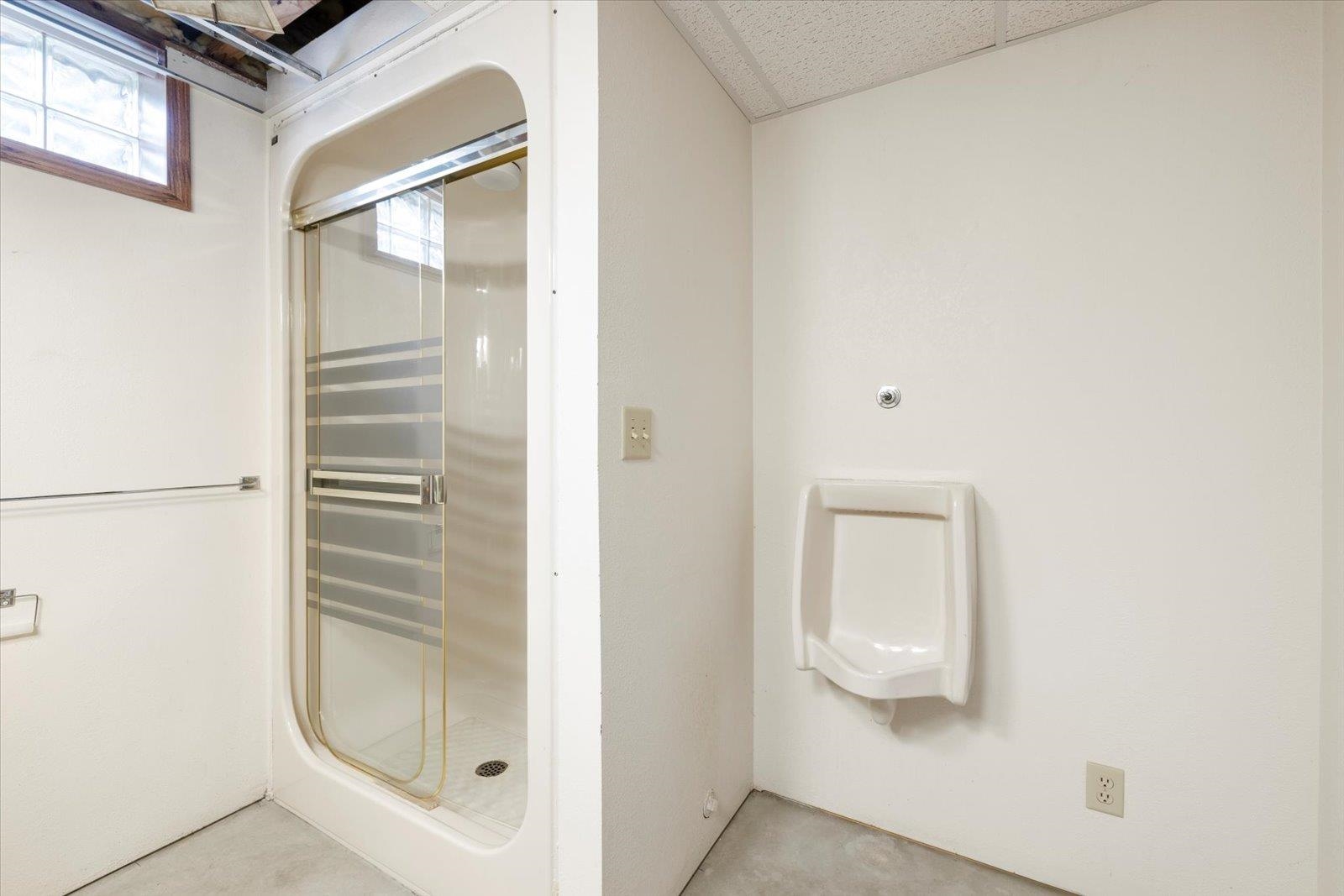 2375 Viste Point Road Ely, MN 55731 - Photo 45 of 83 3/4 bathroom with shower, sink, toilet and urinal