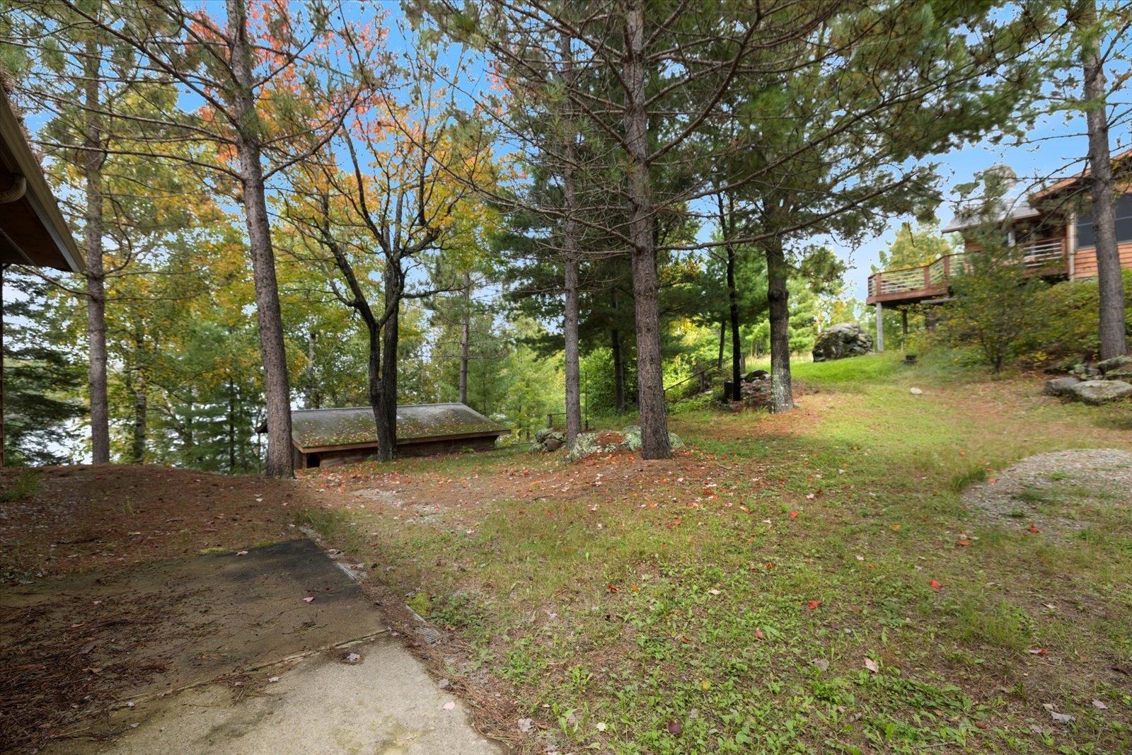 2375 Viste Point Road Ely, MN 55731 - Photo 57 of 83 View of yard with deck and sauna