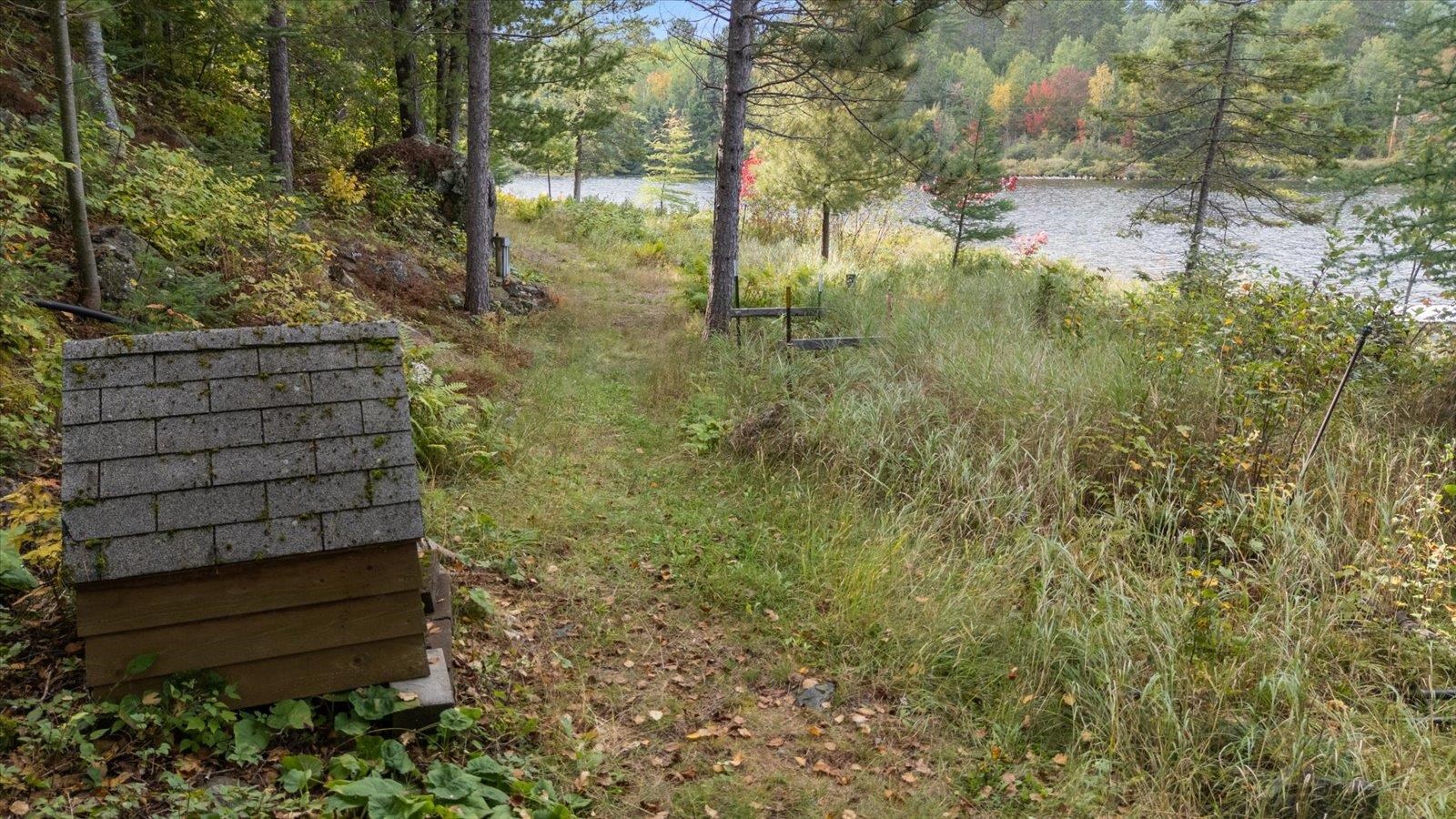 2375 Viste Point Road Ely, MN 55731 - Photo 68 of 83 View of yard featuring a water view and a view of trees