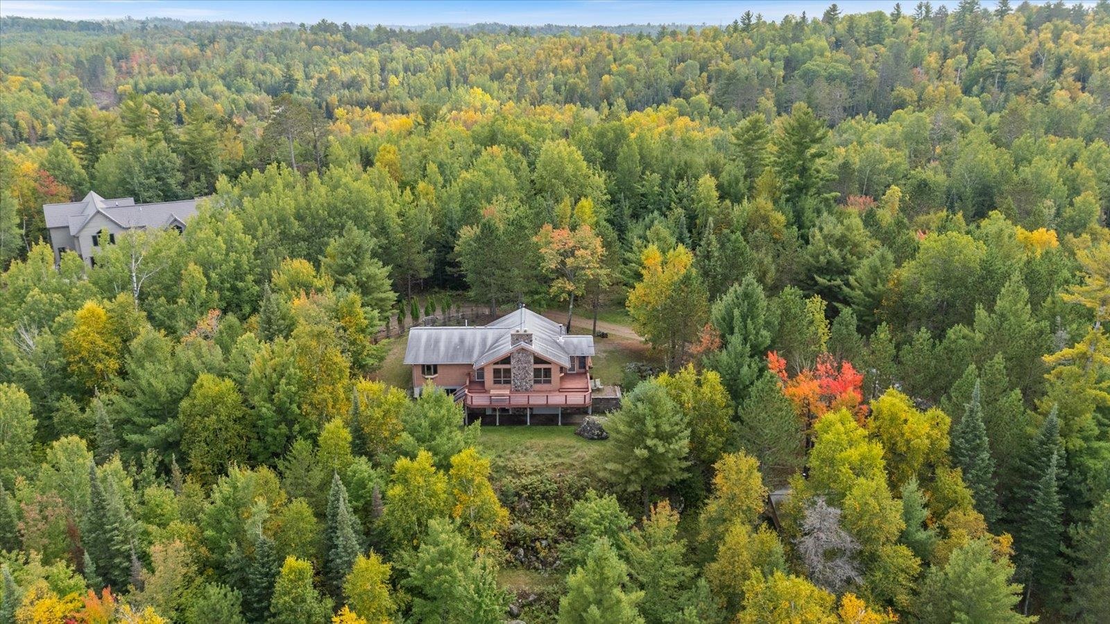 2375 Viste Point Road Ely, MN 55731 - Photo 69 of 83 View of subject property with a heavily wooded area