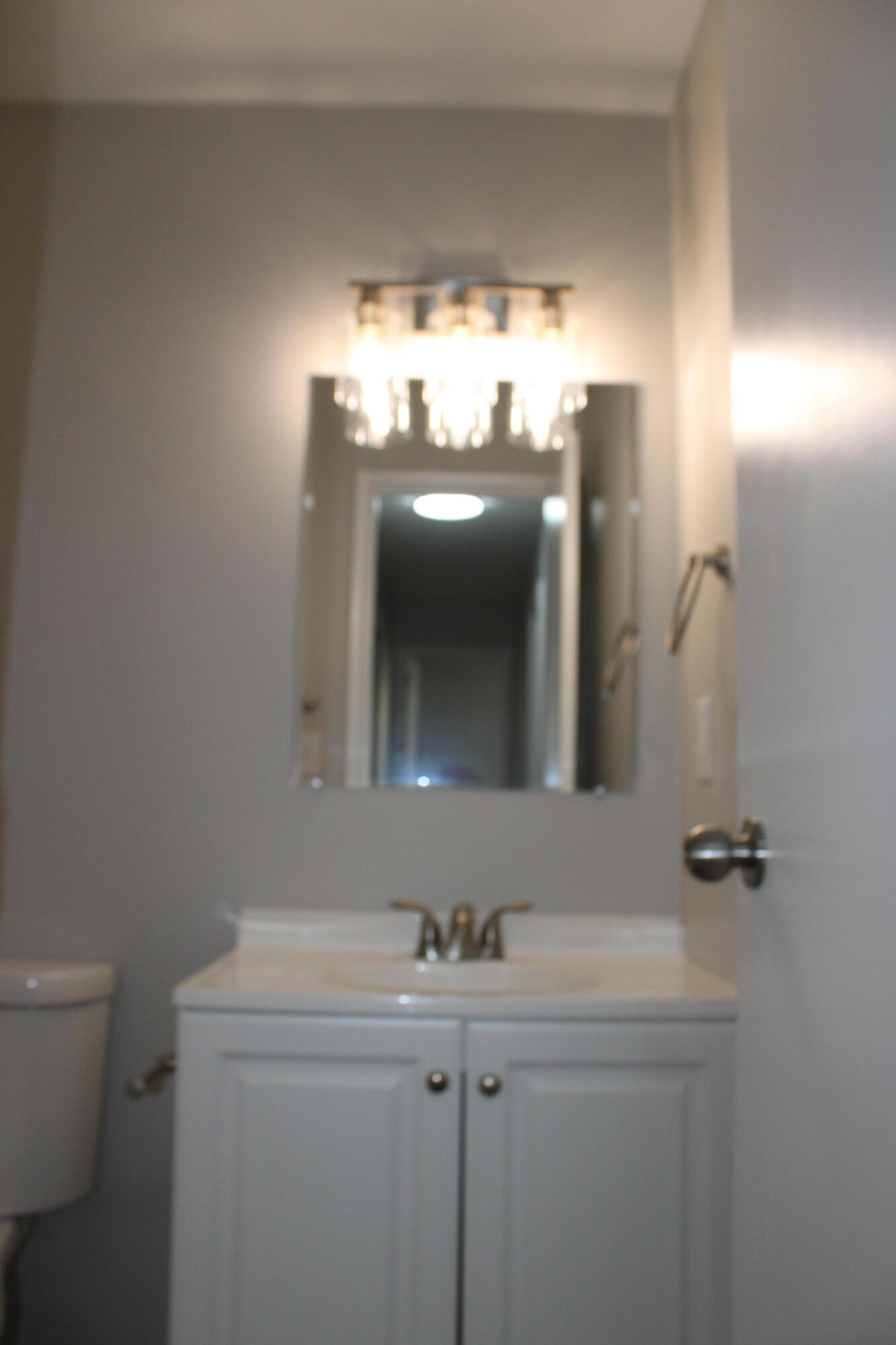 3332 Hillis Road Augusta, GA 30906 - Photo 14 of 32 New vanity, mirror and light fixture.