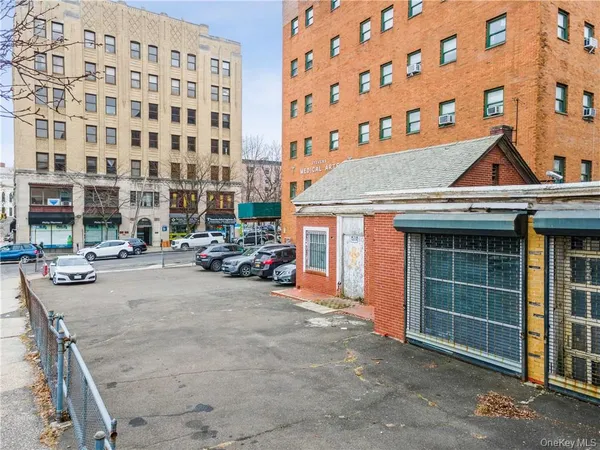 a view of multiple houses with a yard